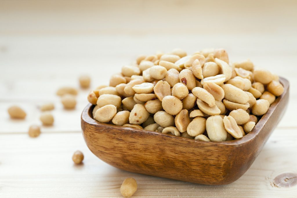 Salted, roasted, peanuts in a wooden bowl